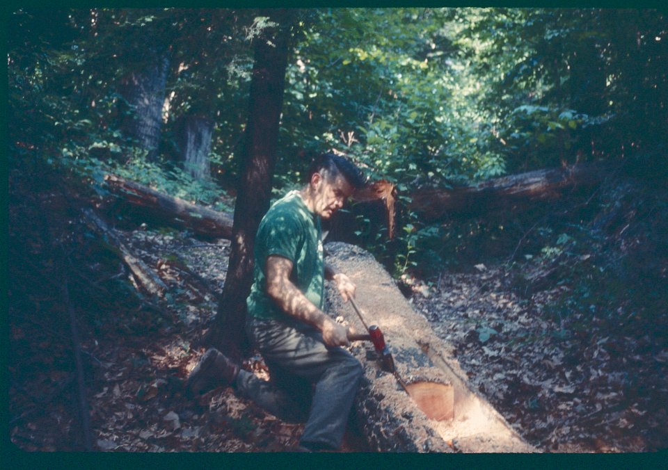 Bill Lankton making dugout canoe 1969